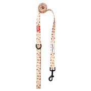 Cream-colored dog leash with red hearts and black hardware from Moomins Yellow Sunrise collection