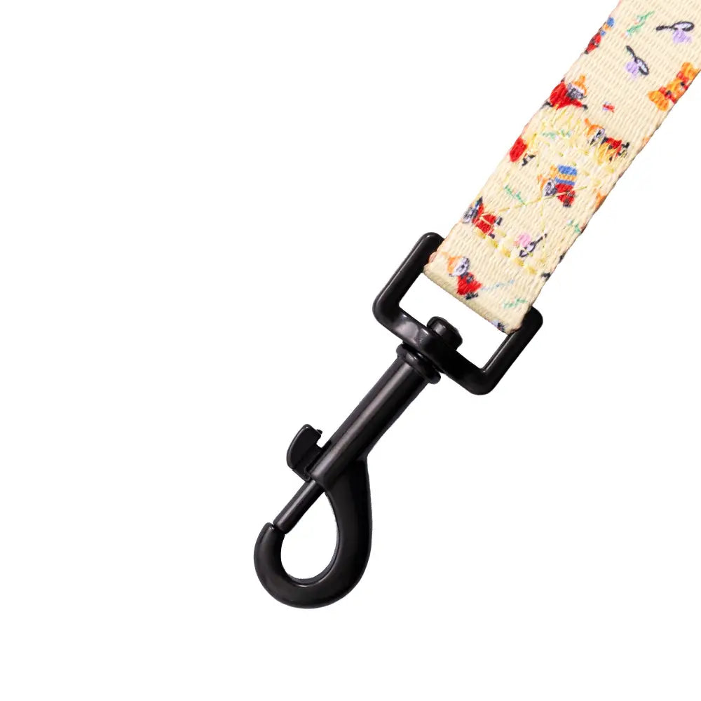 Beige and colorful patterned dog leash with black hardware for Moomins Yellow Sunrise Dog Lead