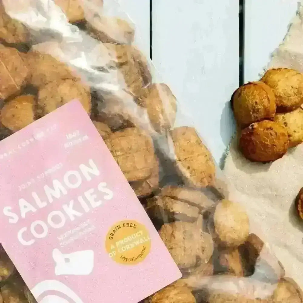 Salmon cookies bag with pink label and white text for natural dog potato cookies with grain-free cornflour