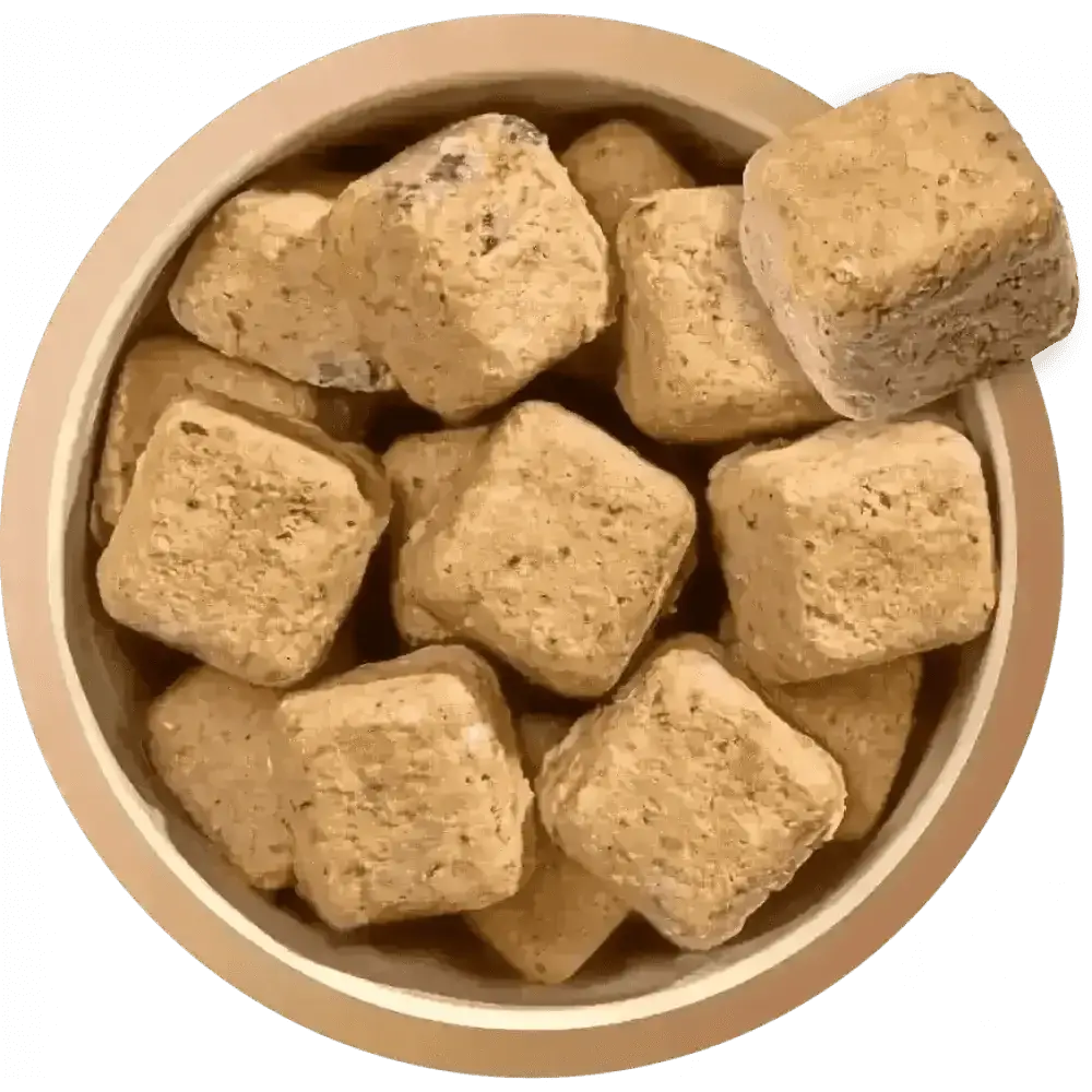 Brown square dog treats in a bowl from Natures Menu 80/20 Salmon and Chicken dog food