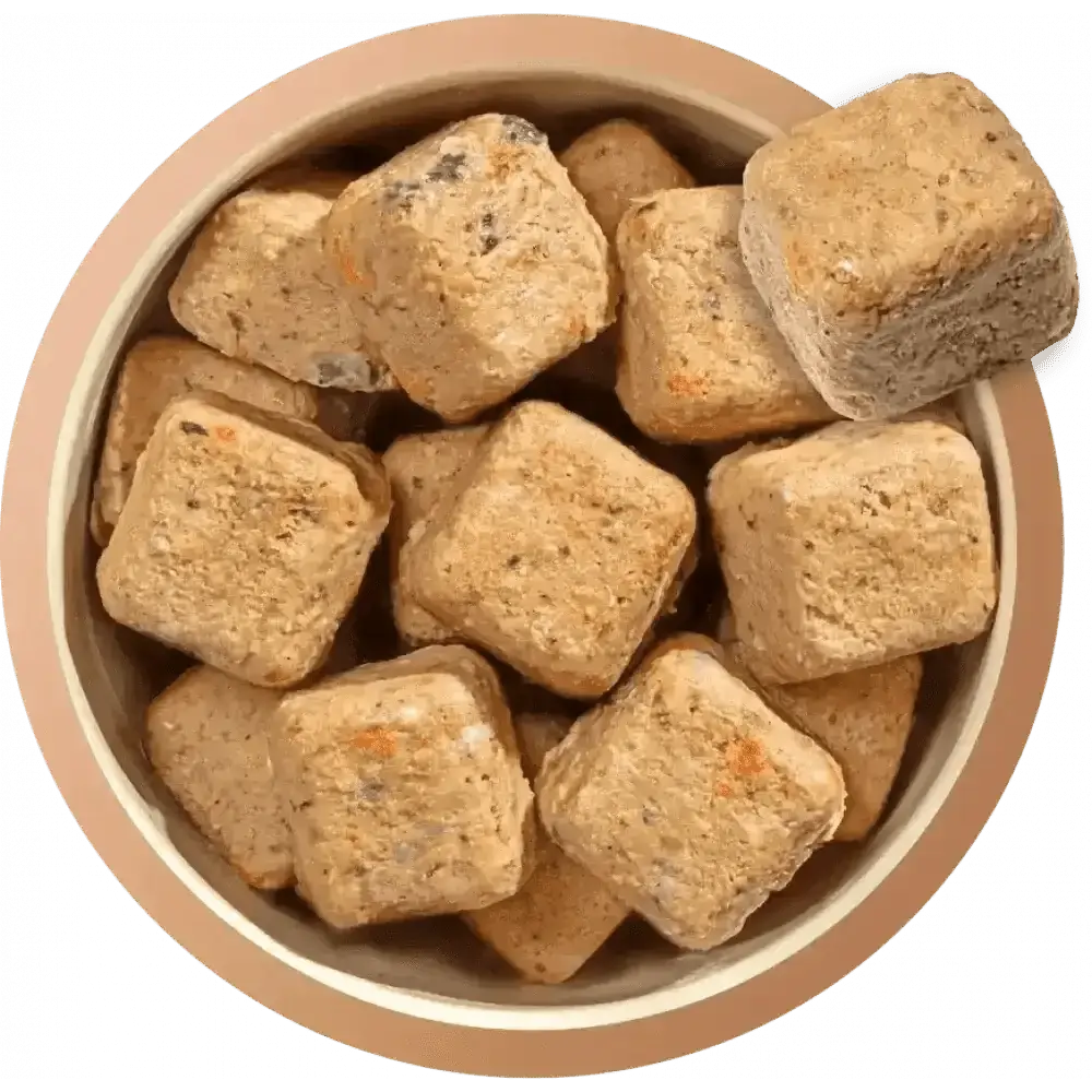 Brown square dog treats in a bowl from Natures Menu 80/20 Salmon and Chicken dog food
