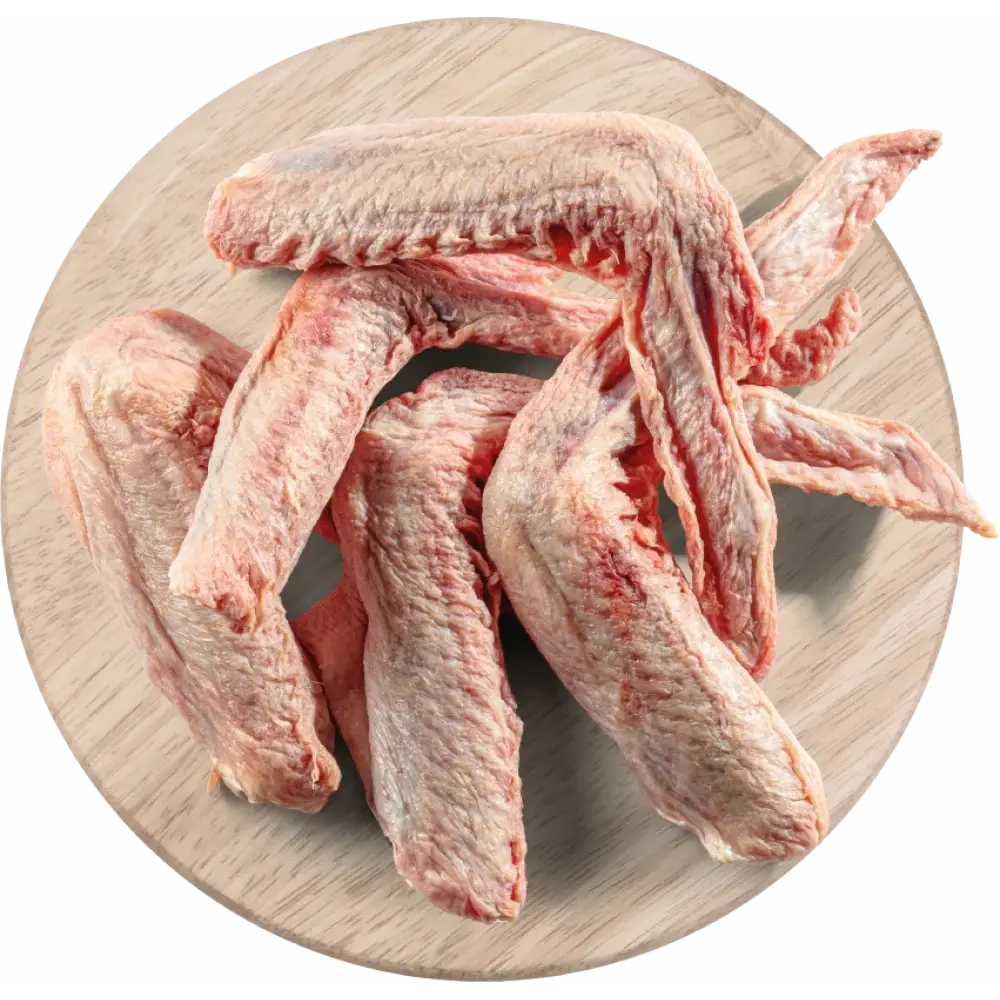 Raw responsibly sourced duck wings for dogs on wooden plate