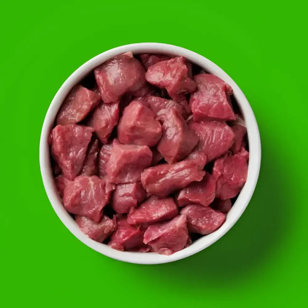 Nutriment’s lamb recipe raw beef cubes in white bowl, human-grade quality