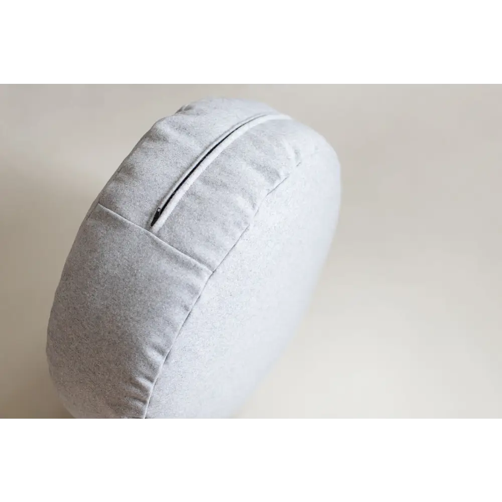 Light gray circular Floor Cushion with zipper detail and soft fabric texture for comfortable seating