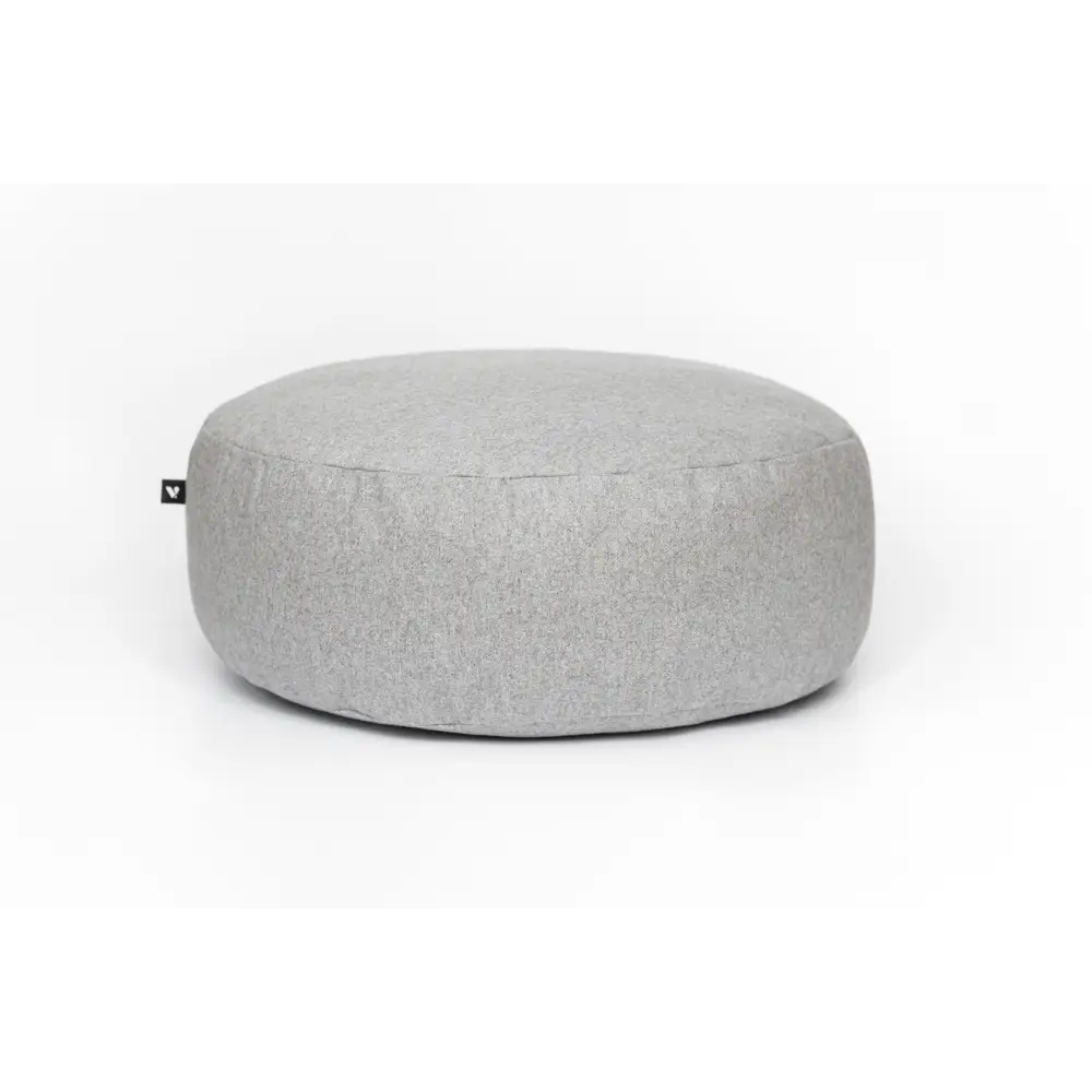 Light gray textured floor cushion ottoman with minimalist design and small logo