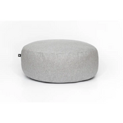 Light gray textured floor cushion ottoman with minimalist design and small logo