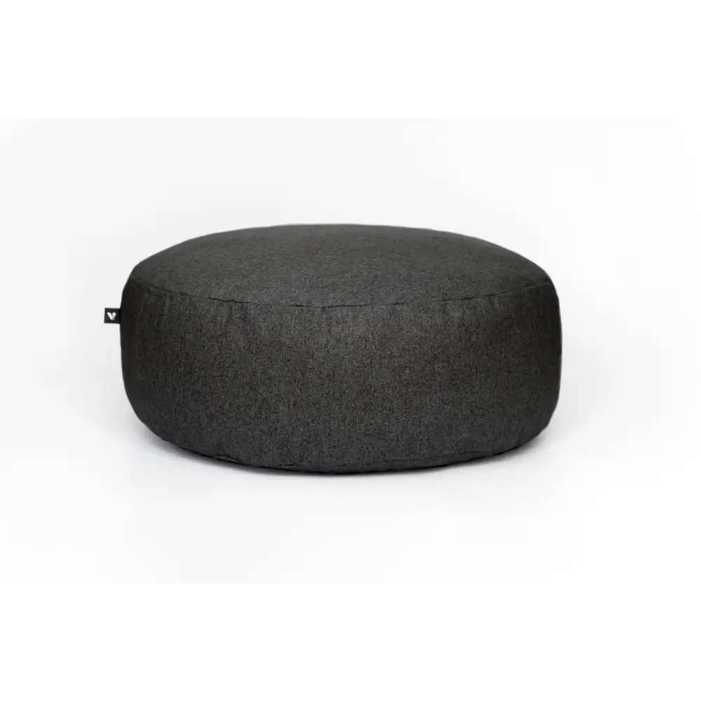 Charcoal gray round floor cushion with textured surface and minimalist design for comfort