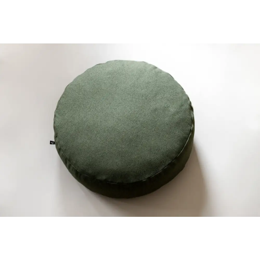 Olive green textured floor cushion with small zipper detail, perfect for stylish seating
