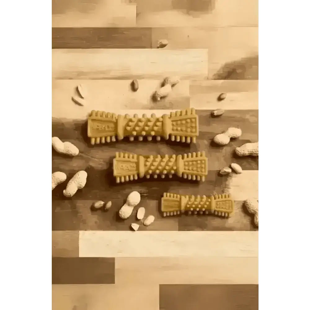 Golden textured Petello Nobblys Tough Brush dog chew toy with peanut shells and peanut butter