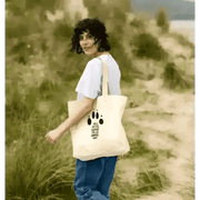 Organic cotton shopper bag with black paw print and girl who loves paws text