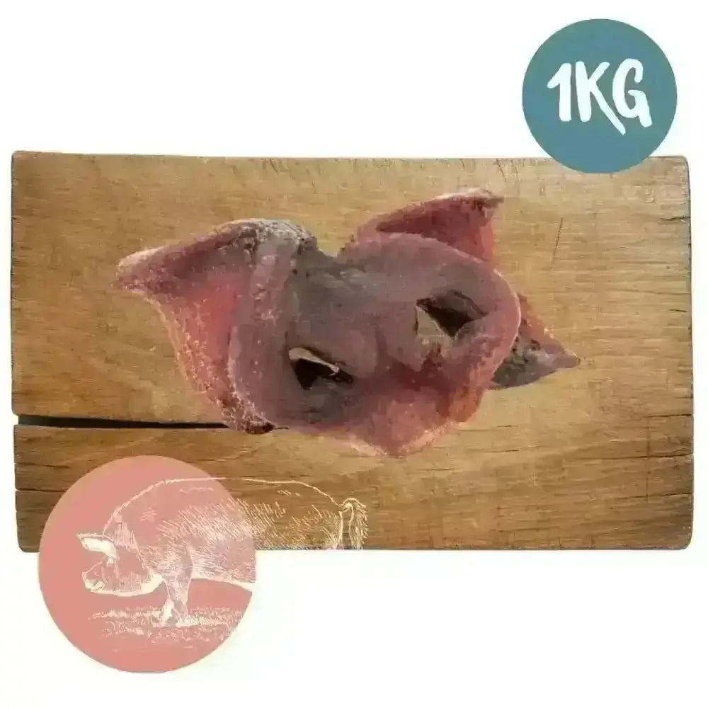1kg bag of air-dried pork snouts for dogs on wooden board