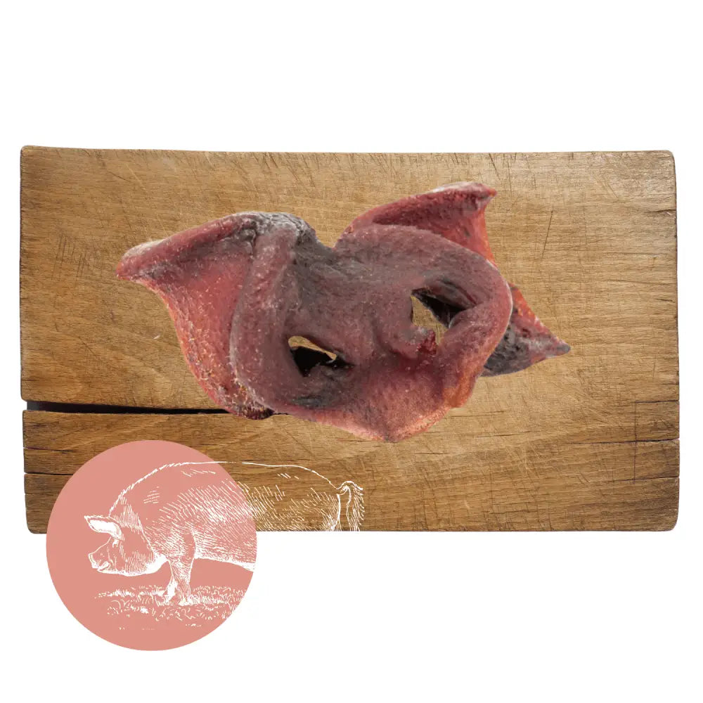 Wooden cutting board with carved pig head and air-dried pork snouts design