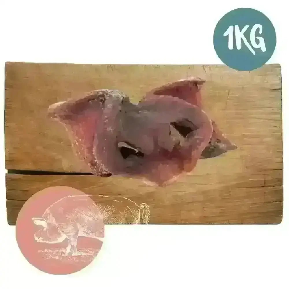 1kg bag of air-dried pork snouts for dogs on wooden board