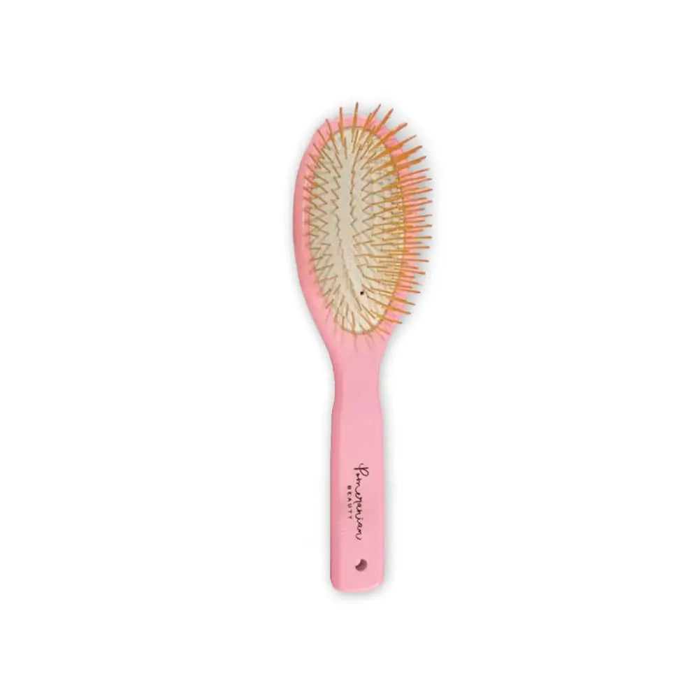 Pink hair grooming brush with natural bristles and heart-shaped handle detail for Pomeranian Beauty Rose Gold Grooming Brush