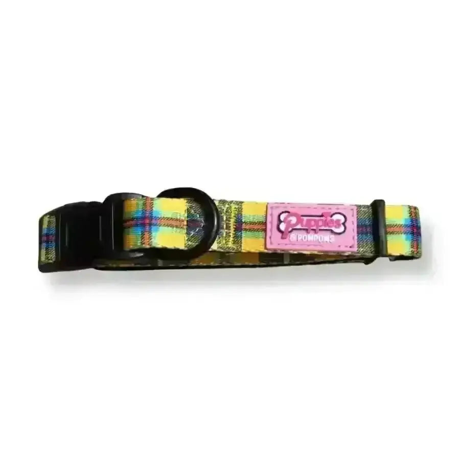 Plaid dog collar with pink and white label, black buckle, yellow background.