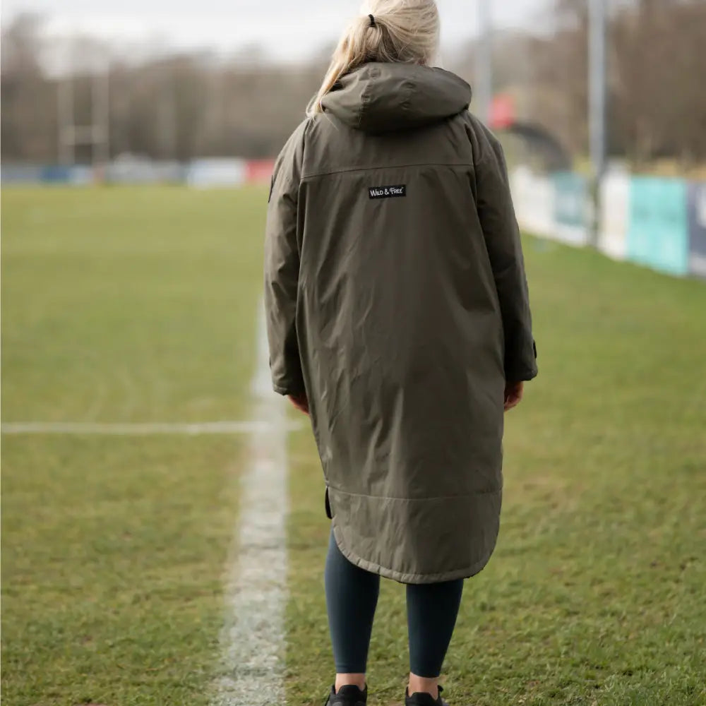 Olive green hooded changing robe parka with black accents