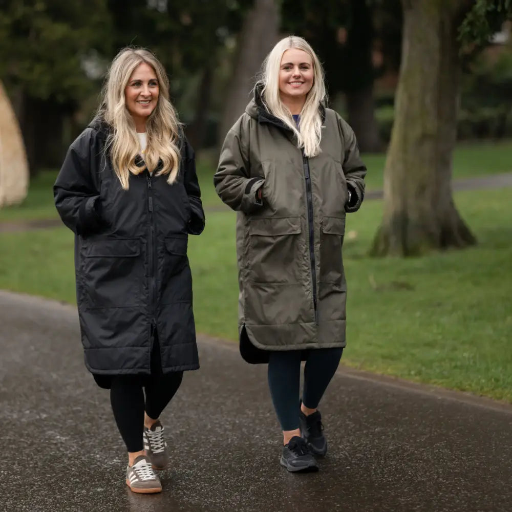 Black nylon parka with hood and zipper, changing robe raincoat in olive green