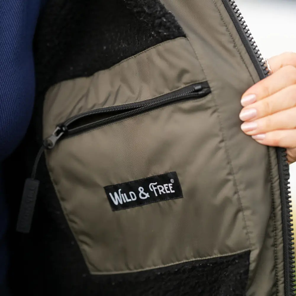 Olive green and black changing robe jacket with Wild & Free logo