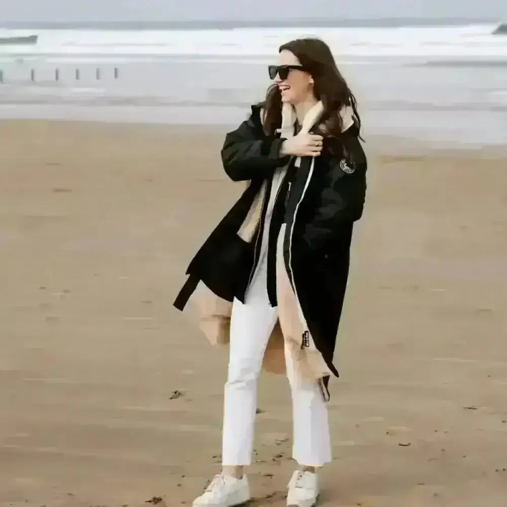 Black leather changing robe with fur-lined hood and zippers