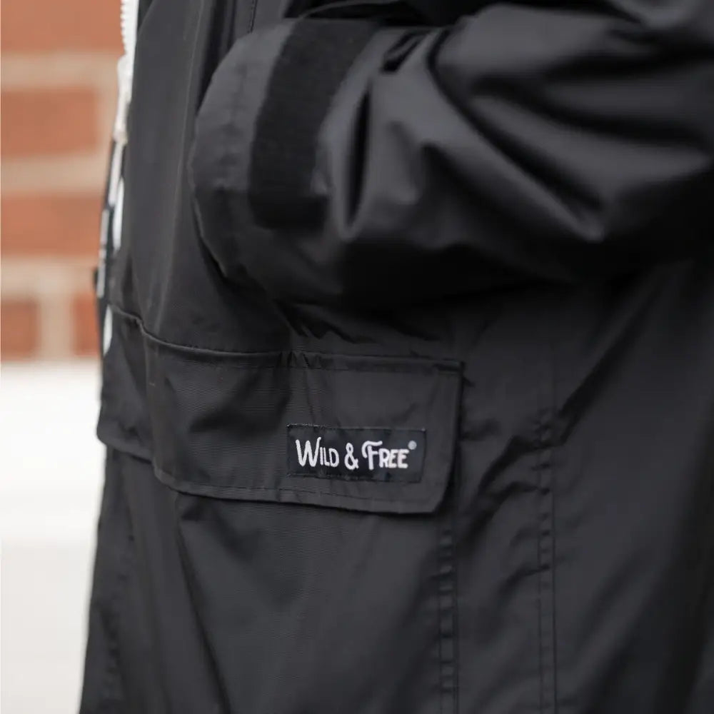 Black waterproof changing robe jacket with hood and Wild & Free logo