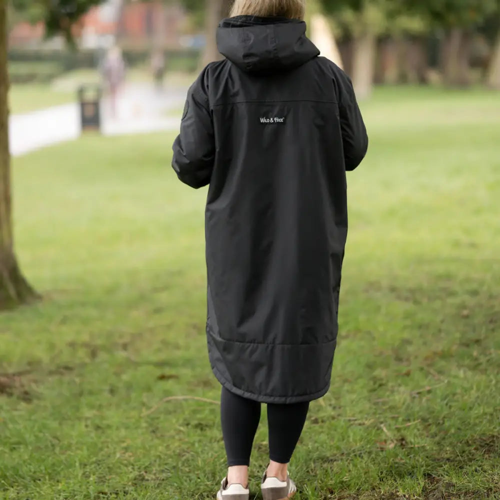 Black waterproof parka with hood, logo, and changing robe design