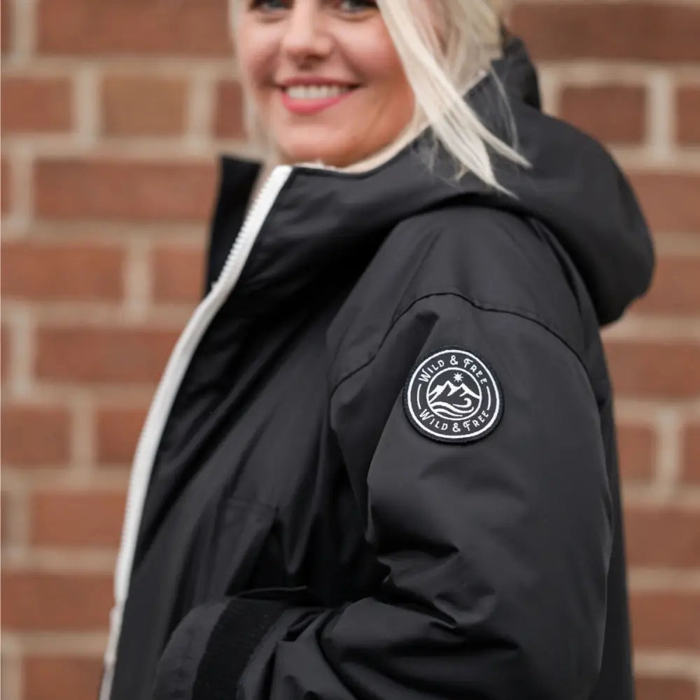 Black waterproof changing robe jacket with hood and white logo