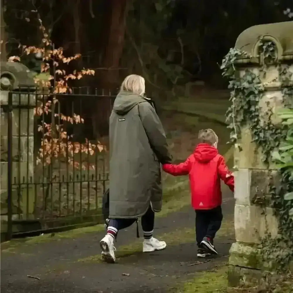 Olive green Classic Cobe changing robe with hooded jacket, white sneakers, red hoodie
