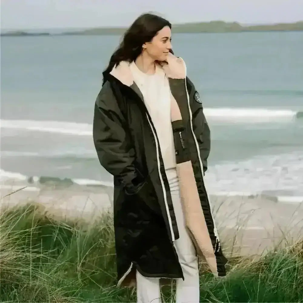Olive green changing robe with black and white puffer jacket fur hood