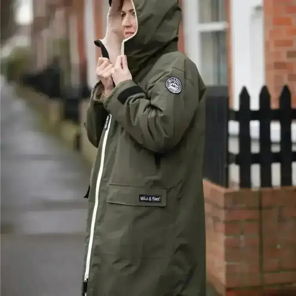 Olive green hooded Classic Cobe changing robe with white zipper and black accents