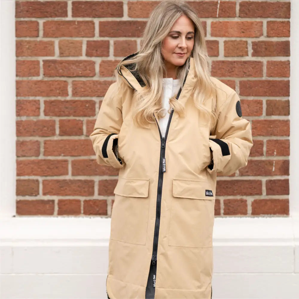 Beige Cobe Black Edition changing robe with black accents and hood