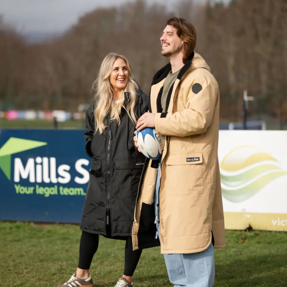 Black and camel changing robe with fur hood, quilted coat design