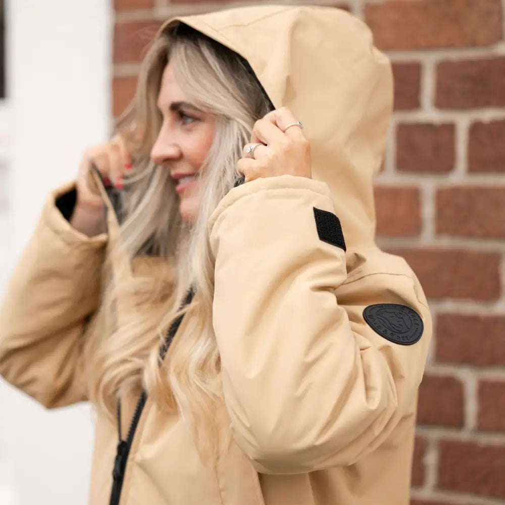 Beige Cobe Black Edition changing robe with black accents and nylon patches