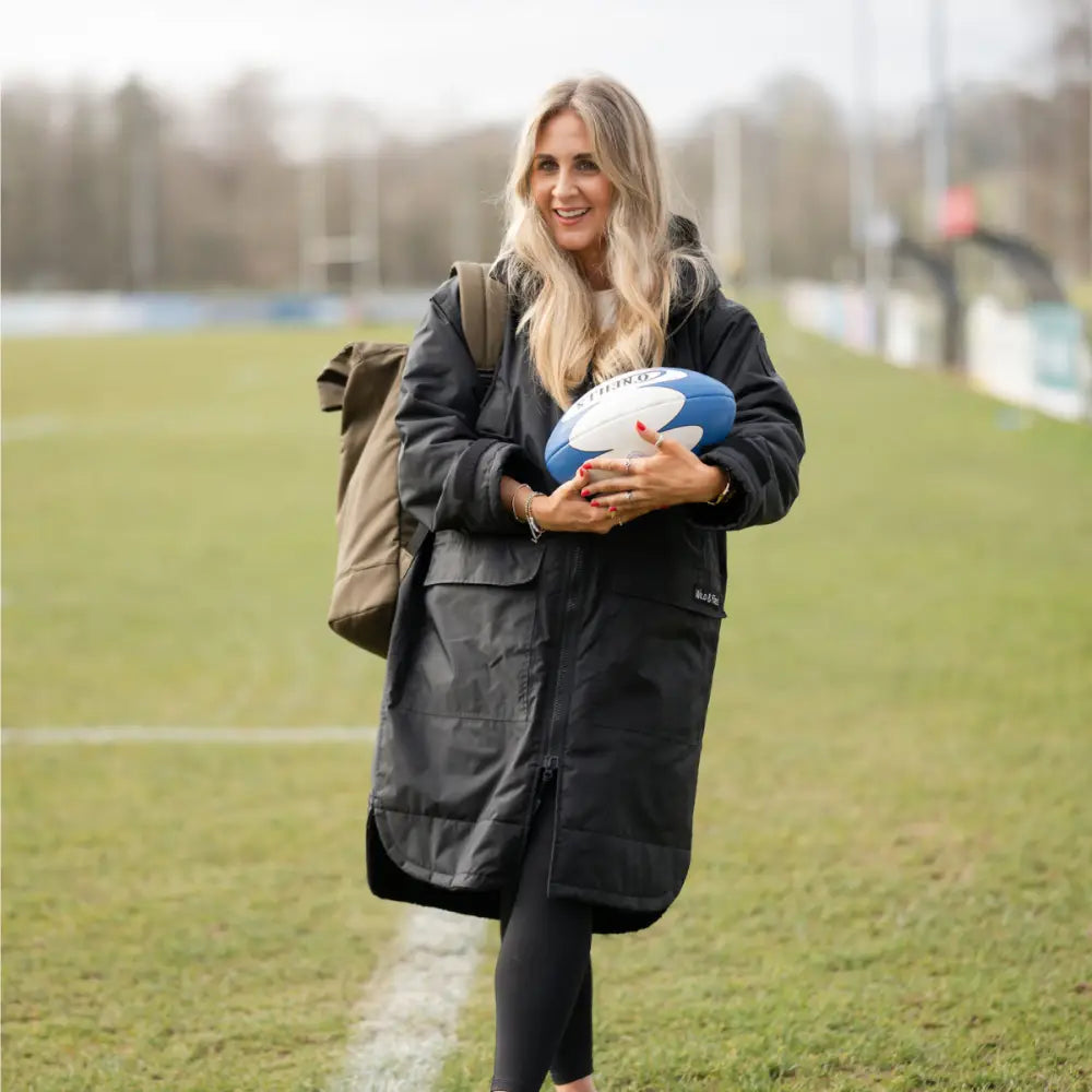 Black Cobe changing robe parka with hood, zipper, and rugby ball