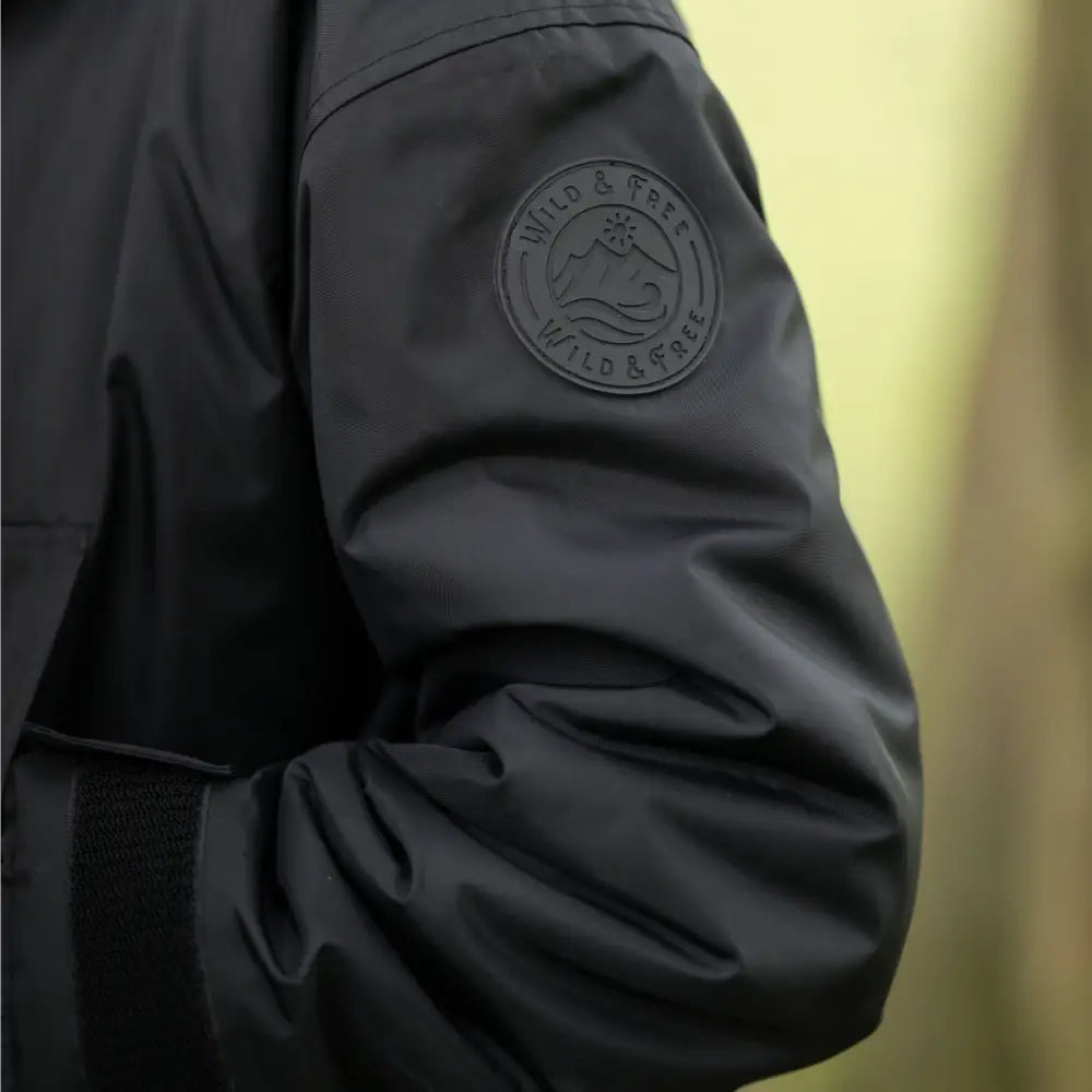 Black waterproof changing robe jacket with embossed logo on sleeve