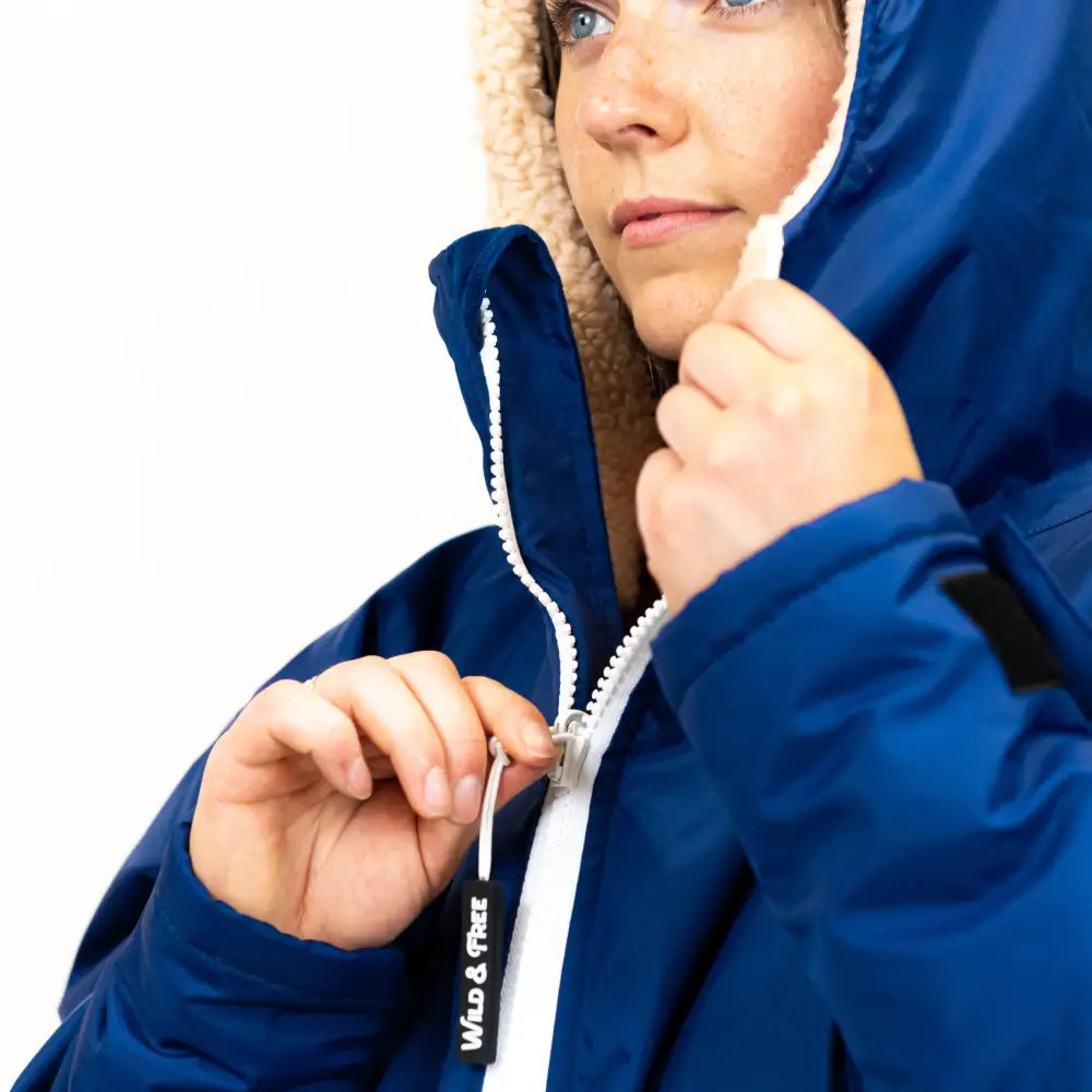 Navy Cobe changing robe: blue hooded jacket with white fur and zipper