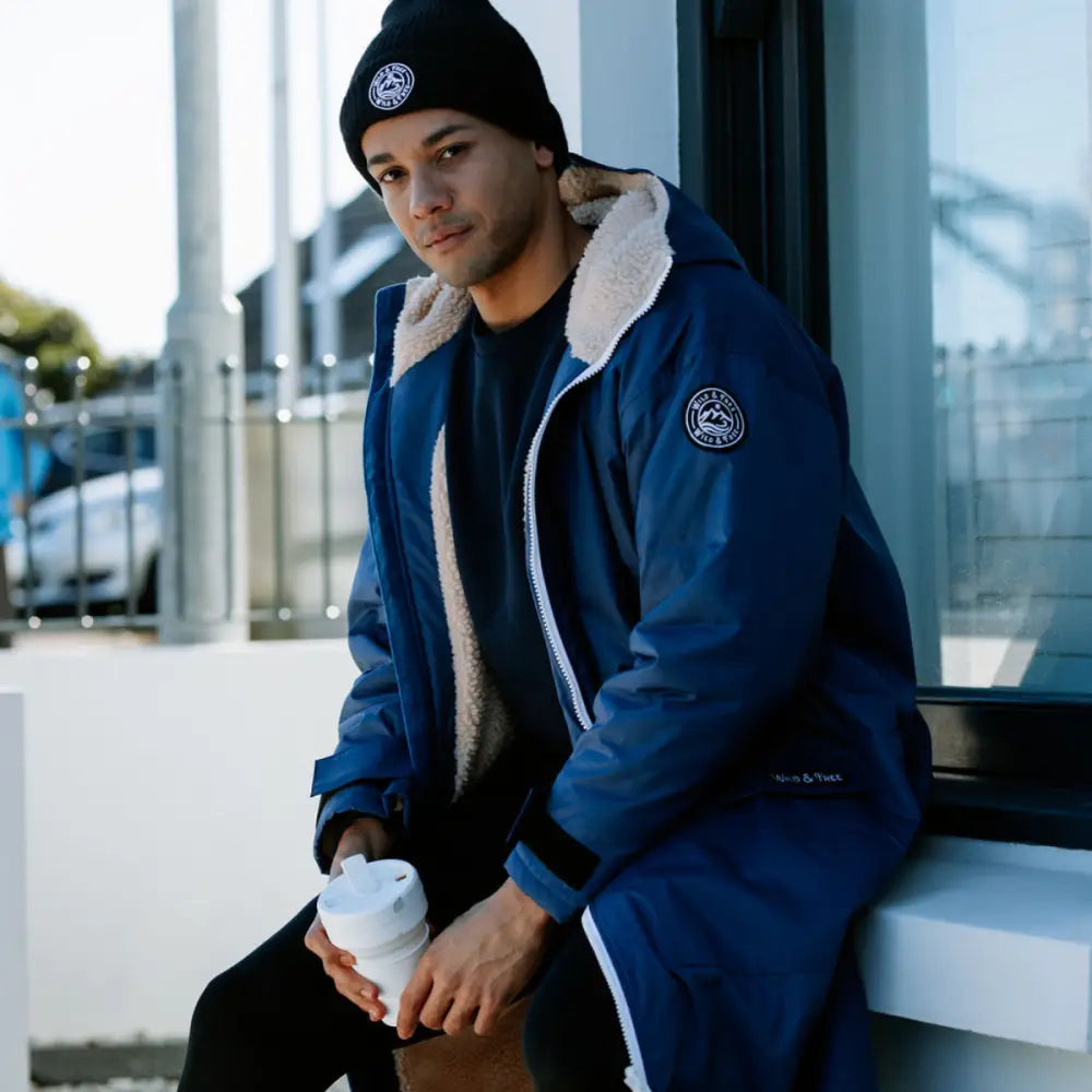Navy changing robe with blue shearling-lined bomber jacket and white trim
