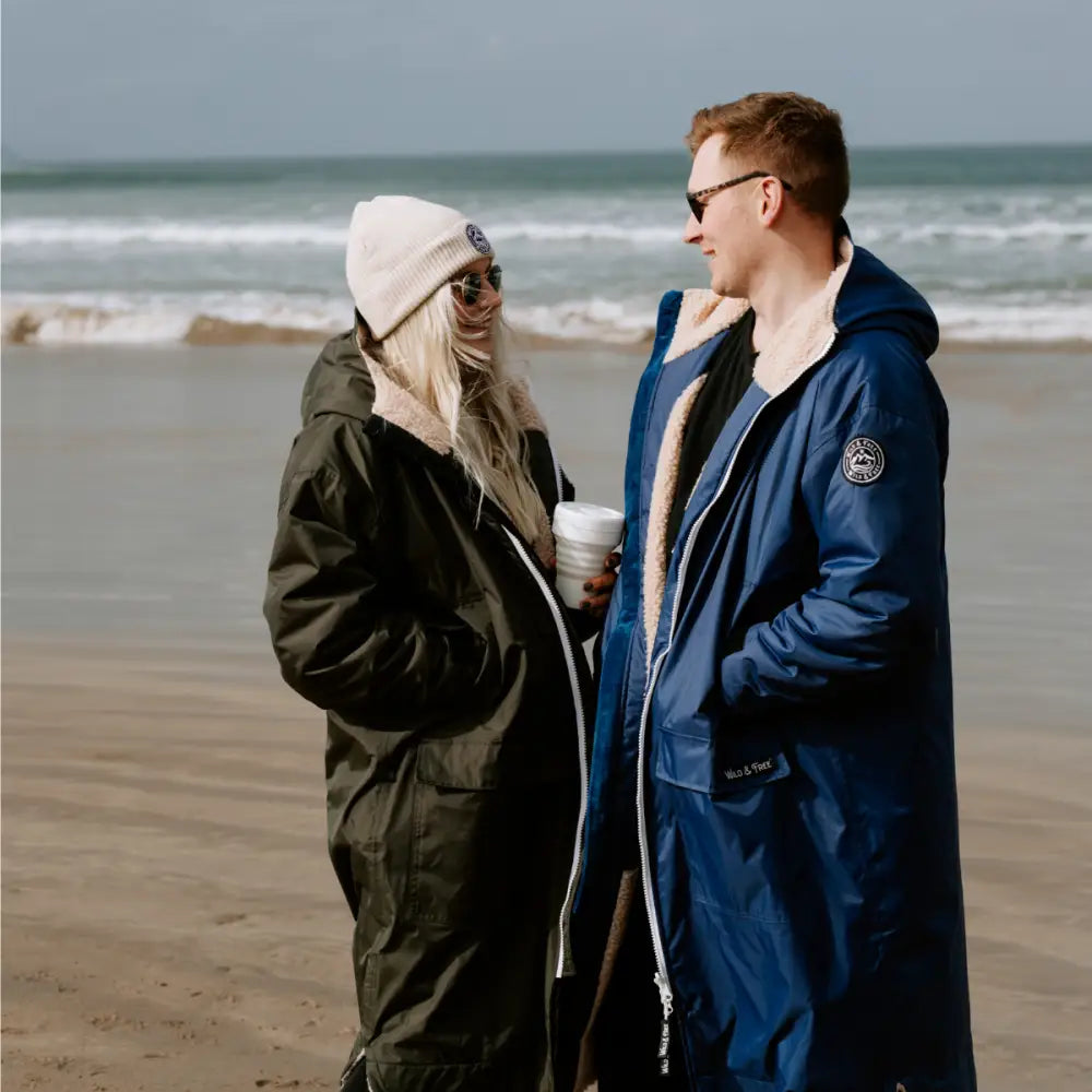 Olive green hooded changing robe parka with fur collar and beanie