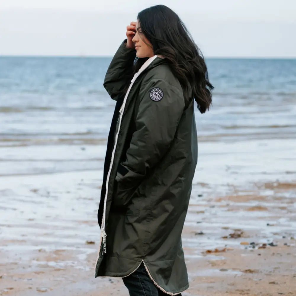 Olive green Canada Goose parka changing robe with white trim hood