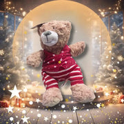 Teddy bear in a festive setting with Christmas trees and lights