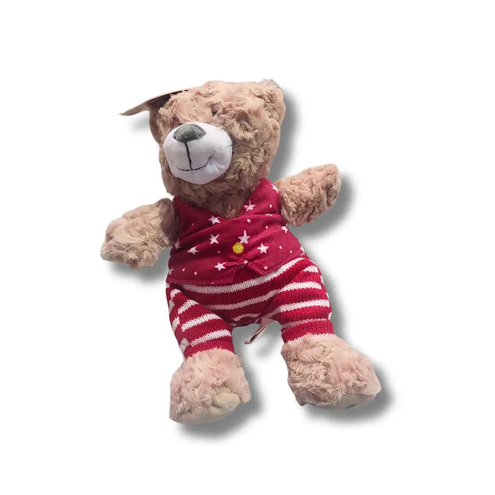 Plush toy dog wearing a red outfit with white stars and stripes on a white background Christmas toy