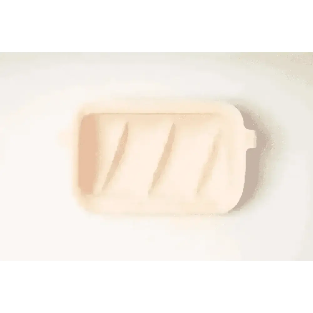 Pastel pink silicone slow feeder baking dish with handles