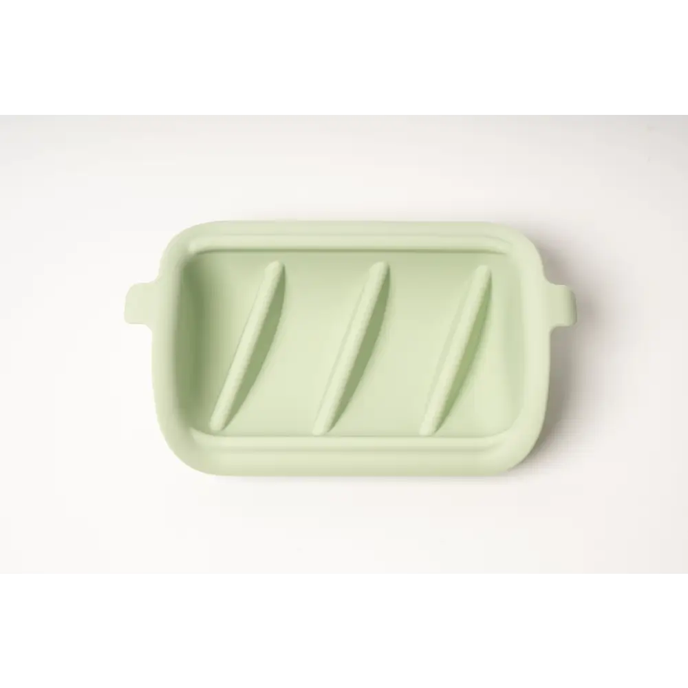 Sage green silicone slow feeder insert with rectangular shape and diagonal grooves