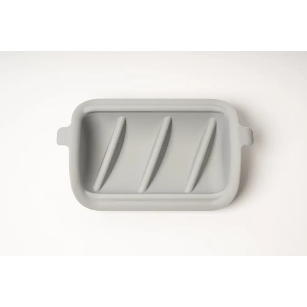 Gray silicone slow feeder insert with ridges and rounded handles