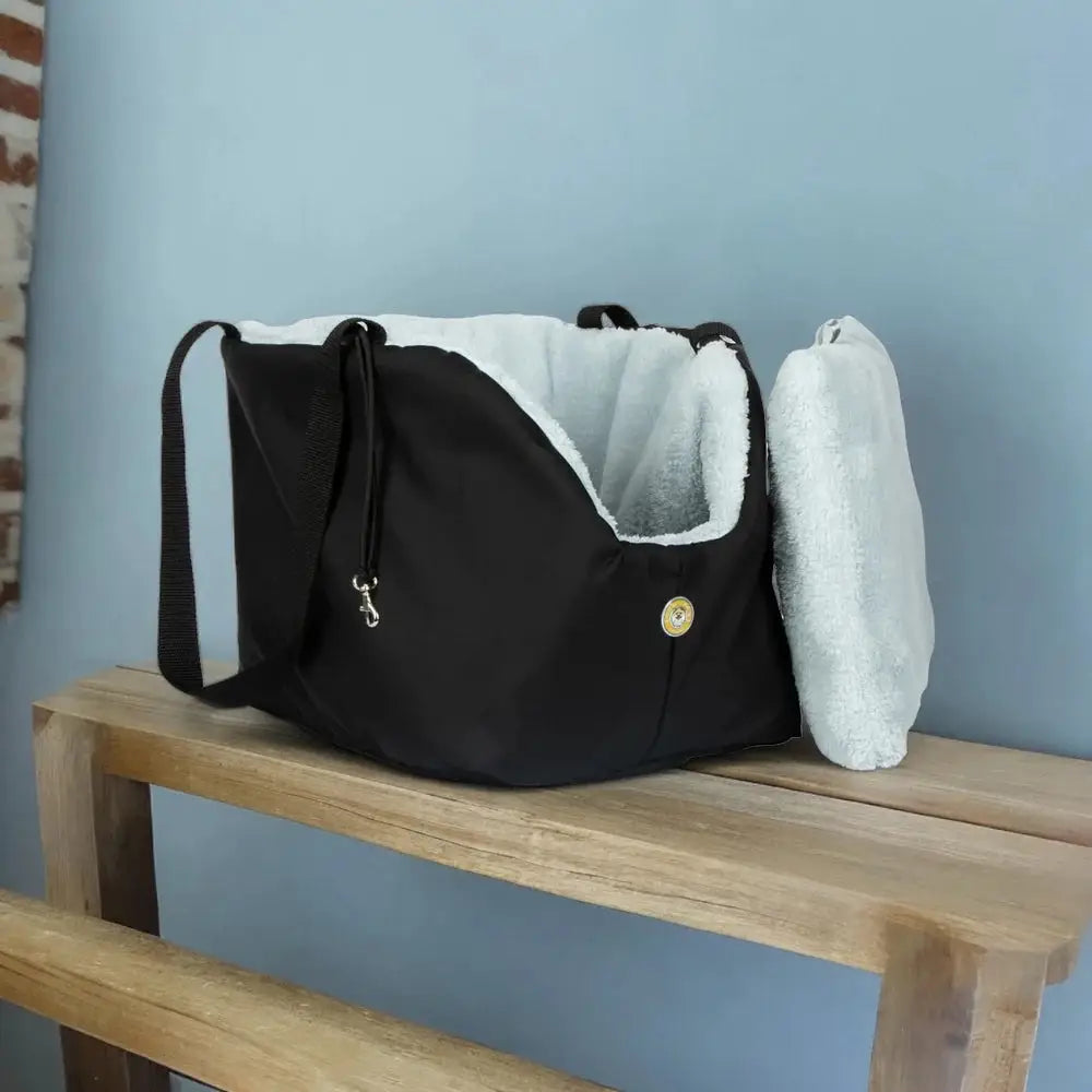 Black and white Soho Poms Black pet carrier with plush lining and durable fabric