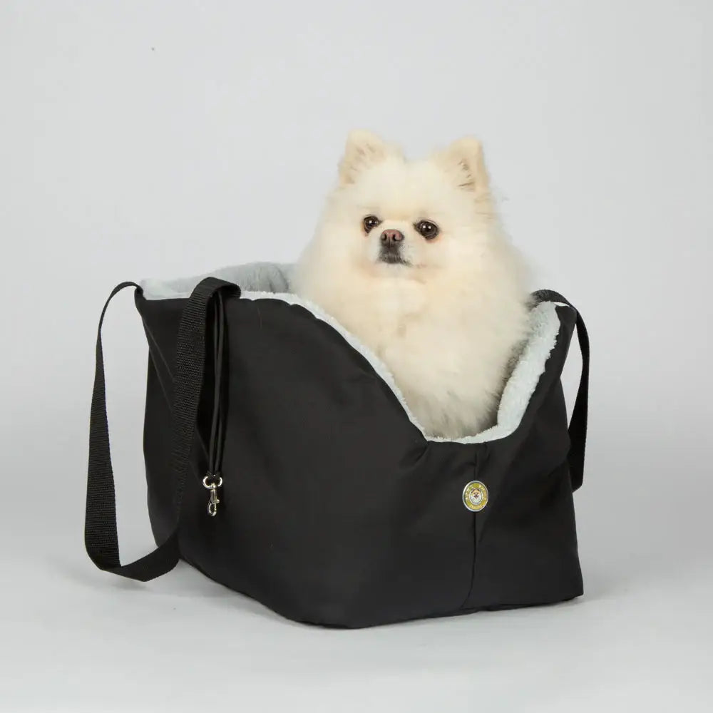 Black and gray Soho Poms pet carrier with fleece lining and adjustable strap