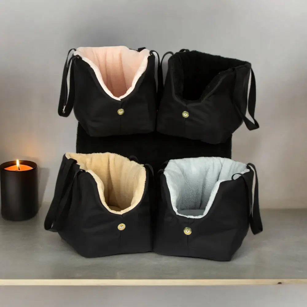 Black and pink Soho Poms luxury rainy bear dog carrier with gold button closure