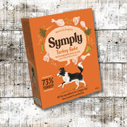 Symply Turkey Bake Adult Wet Dog Food box on orange background