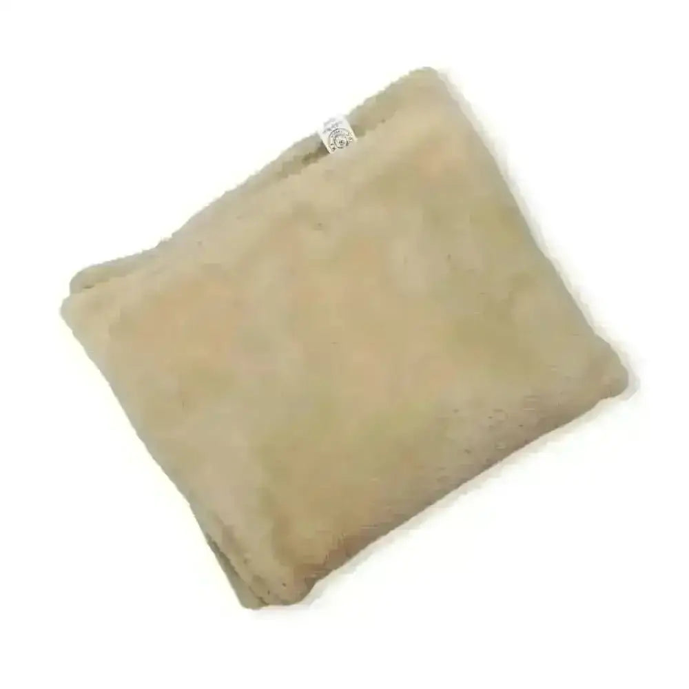 Beige plush dog blanket by Soho Poms with soft fuzzy texture and white tag