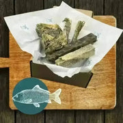 Wooden cutting board with large wolf fish stick design in The Fish Chew Box