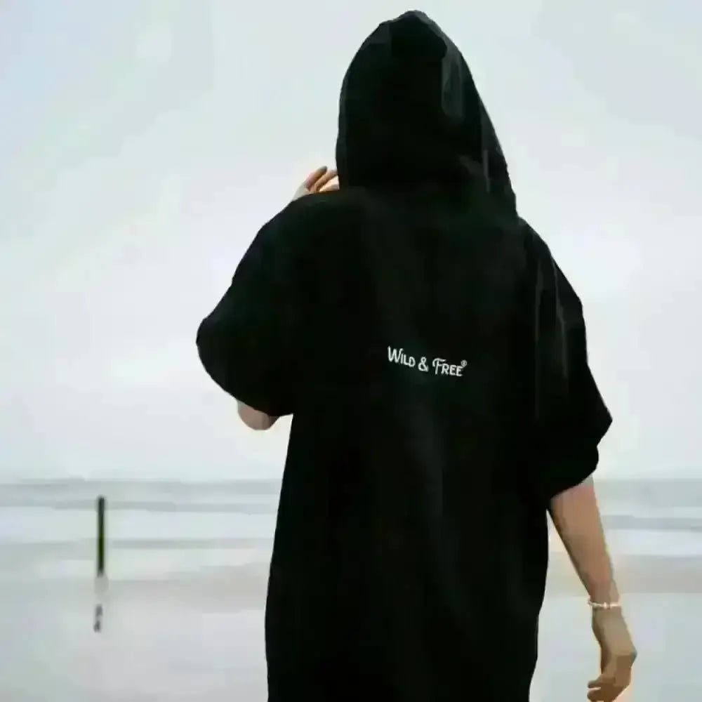 Black hooded towel robe with wild and free text and pocket